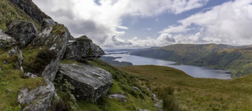 Rocks at the summit and views of Loch Lomond and the Loch Lomond and the Trossachs National Park
