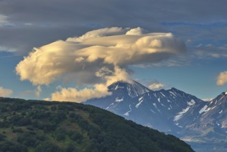 Dramatic spectacular lenticular cloud formation over volcano on Kamchatka peninsula, Russia, Europe