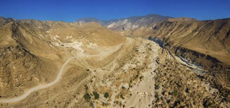 Landscape in Oman, mountains, Wadi Ashawq, road, dry riverbed Salalah, Al Mughsyal / Wadi Ashawq,
