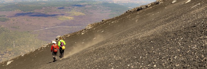 Mount Etna in Italy, Sicily. Climb Etna volcano to the top. Europe. Banner web with copy space