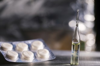 Pills, Syringe And Ampoule With Vaccination On Dark Table