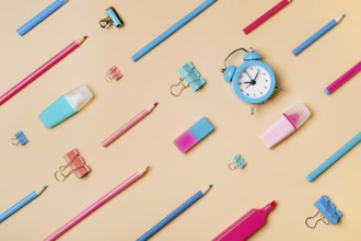 Creative student desk modern school supplies on neutral pastel beige background. Top view flat lay.