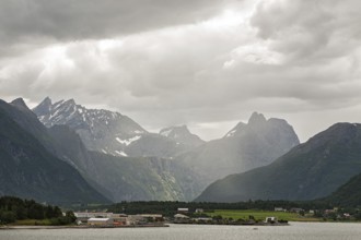 Andalsnes and mountains along the Romsdalsfjorden under a cloudy sky, Norway, Europe