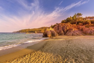 Vourvourou, Chalkidiki or Halkidiki, Greece summer sunset scenery with turquoise sea, forest green