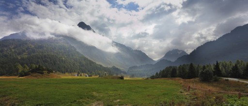 Wonderful valley in the mountains of northern Italy. The cloudy autumn day