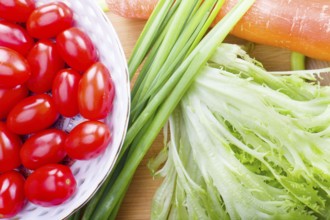 Raw health vegetables on wooden kitchen table