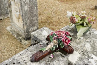 Very old stone graves with moss at the cemetery