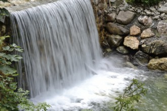 Small stream with wide waterfall