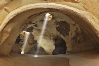 Famous Belfry Beit Guvrin caves in Israel. Giant halls regular shape with a hole in the roof.