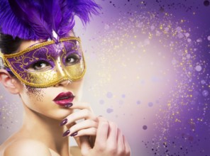 Beautiful woman with dramatic mekaup and pruple lipstick wearing puprle mask. Light background.