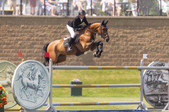 Darragh Kenney of Ireland and riding Eddy Blue, compete in the 1.60m Grand Prix during The