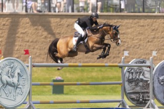 Vaclav Stanek from Czechoslovakia, and riding Quintin, compete in the 1.60m Grand Prix during The