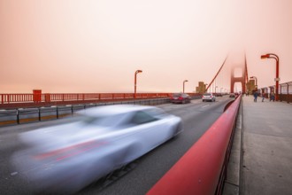 Cars crossing the San Francisco, Californian Golden Gate Bridge from the Presidio Pacific point to