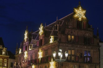 Historic, darkly lit building with Christmas strip lighting, nijmegen, the netherlands