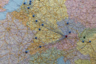 Nodes and networks are shown on a map of Europe with threads and pins, Austria, Europe