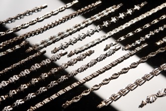 Golden bracelets on a studio background