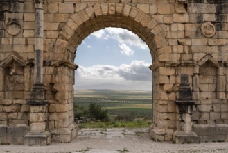 Iconic Triumphal Arch of Volubilis, an old ancient Roman city in Morocco, North Africa