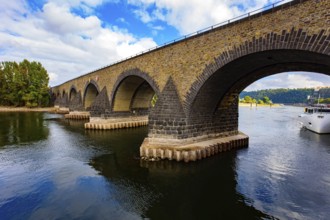 Pleasure boat. Romantic trip to medieval Germany. Scenic Baudouin bridge over the majestic river