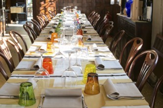 Table in an Italian restaurant. Wooden antique furniture