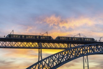 Porto City and Dom Luis Bridge I with Tram at Sunset. Colorful Sky. Portugal