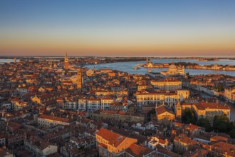 Great sunset mood over the cityscape of the Italian travel destination Venice