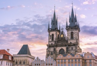 Church of our Lady before Tyn, from Prague Old Town Square, at sunrise, under a beautiful sky