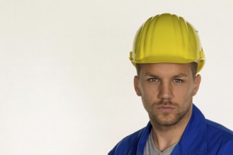 A worker in a commercial enterprise (craftsman) with tools in his hand Austria