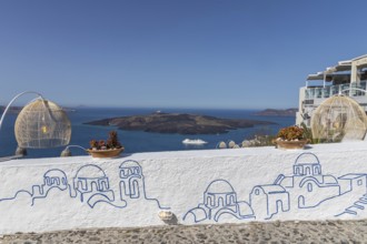 Graffiti on white wall, view from Fira to volcanic island Nea Kameni, island Santorini, Cyclades,