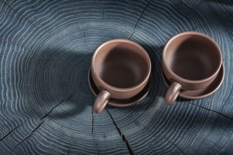 Two Empty Clay Coffee Cups On Wooden Background