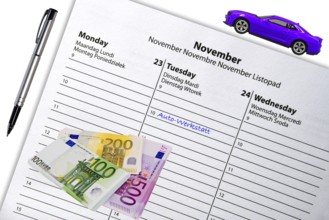 Appointment entry in calendar, car workshop, EURO, banknotes, studio