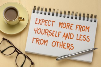 Expect more from yourself and less from others - inspirational handwriting in a sketchbook, a flat