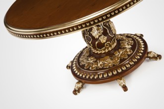 Luxury gold plated part kitchen table in baroque style. Close-up