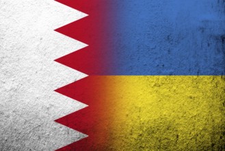 The Kingdom of Bahrain national flag with National flag of Ukraine. Grunge background