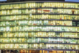 Modern office at night, showing the daily activity of office workers