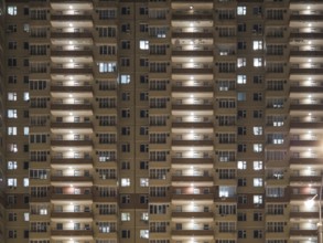 Night view of exterior apartment building. High rise apartments in night light