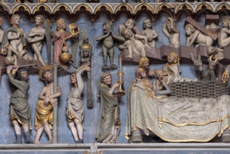 Freiburg, Cathedral of Our Lady, portal vestibule, tympanum, angel with soul scales and praying