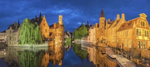 Bruges Belgium, night panorama city skyline at Rozenhoedkaai Dijver Canal with Belfry Tower