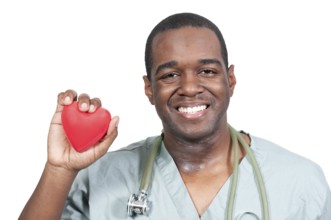 A black male African American doctor cardiologist holding a red heart
