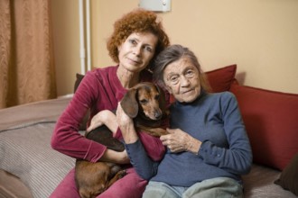 The theme is animal therapy, caring for elderly with dementia and Alzheimer's disease. Adult women