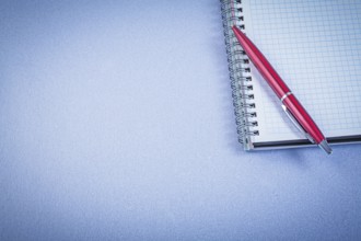 Red ball-point pen notepad office concept