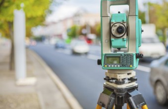 Theodolite on streen of small town