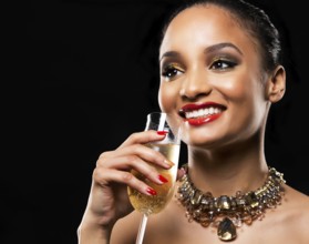 Romantic Indian woman with golden makeup and nailpolish. Big gold fashion necklace. Black isolated