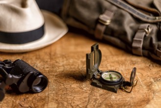 Old expedition map with compass and binoculars