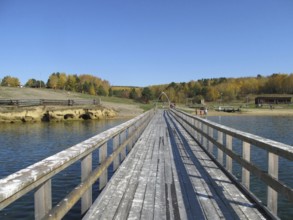 Wooden bridge across the river, outside the city, a place of rest for citizens