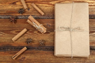 Gift Packed in eco-friendly biodegradable cardboard on dark old wooden background with blank space
