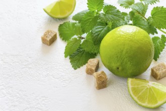 Ingredients for Mojito. Juicy lime, mint and brown sugar, copy space