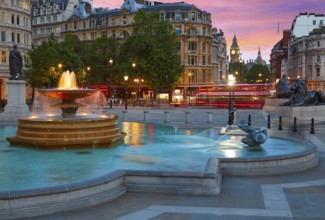 London Trafalgar Square fountain at sunset England