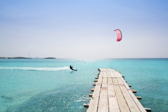 Formentera beach wood pier over turquoise water from balearic Mediterranean sea paradise