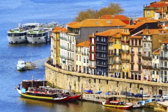 Porto, Portugal old town ribeira aerial promenade view with colorful houses, Douro river and boats
