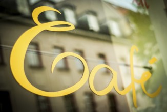 Sign In The Window Of A Urban Cafe